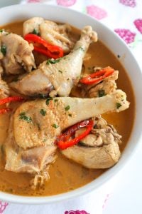 Cooked chicken in a bowl of soup.