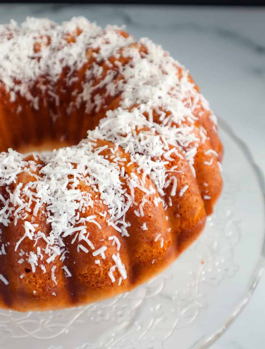 Coconut Cake on a glass dish.
