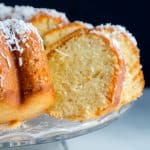 Coconut Cake with some slices removed.