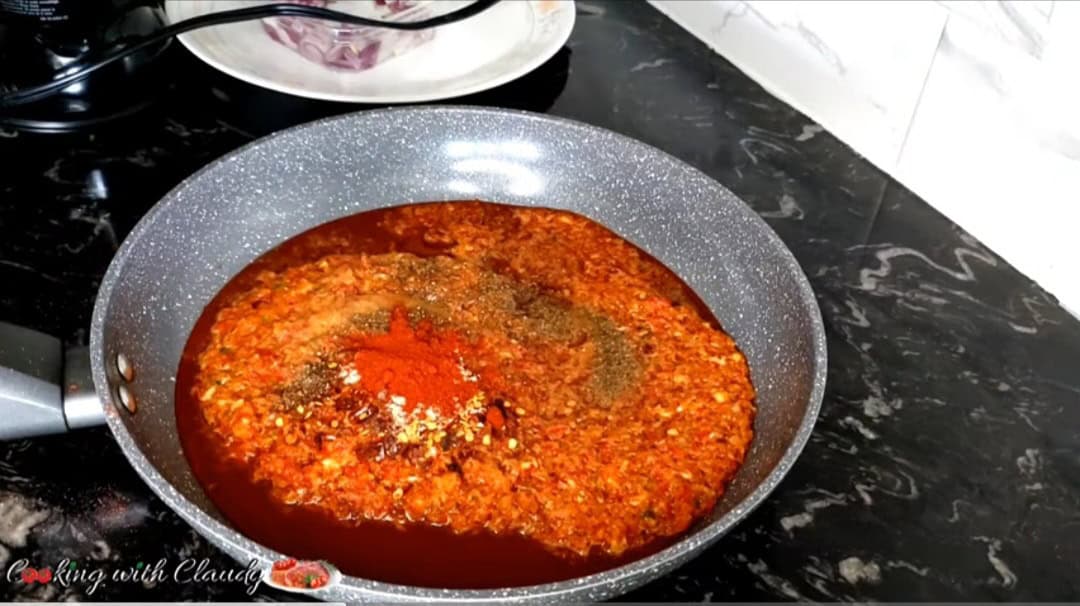grilled whole fish Blended spice mix in a sauce pan.