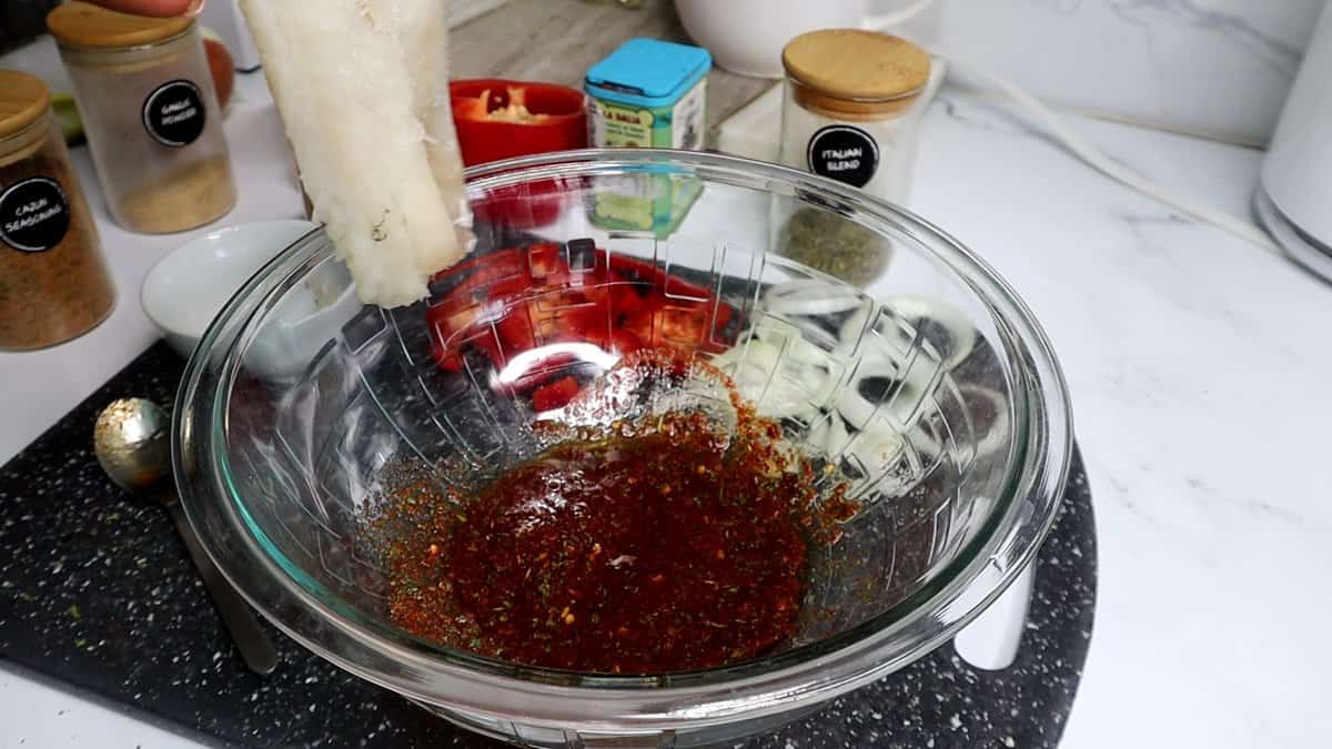Seasoning ingredients in a glass bowl.