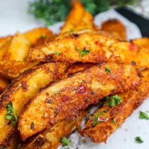 Pile of Crispy Baked Potato Wedges.