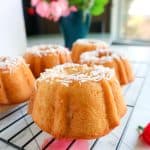 Mini Coconut Bundt Cakes topped with shredded coconut.
