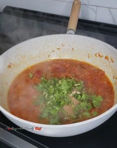 Pan of ingredients topped with parsley.