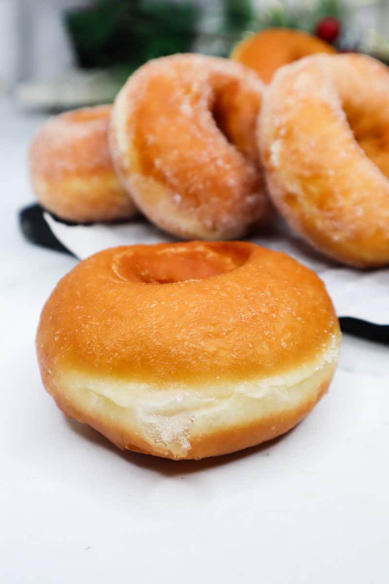 Homemade Donut on a white surface.