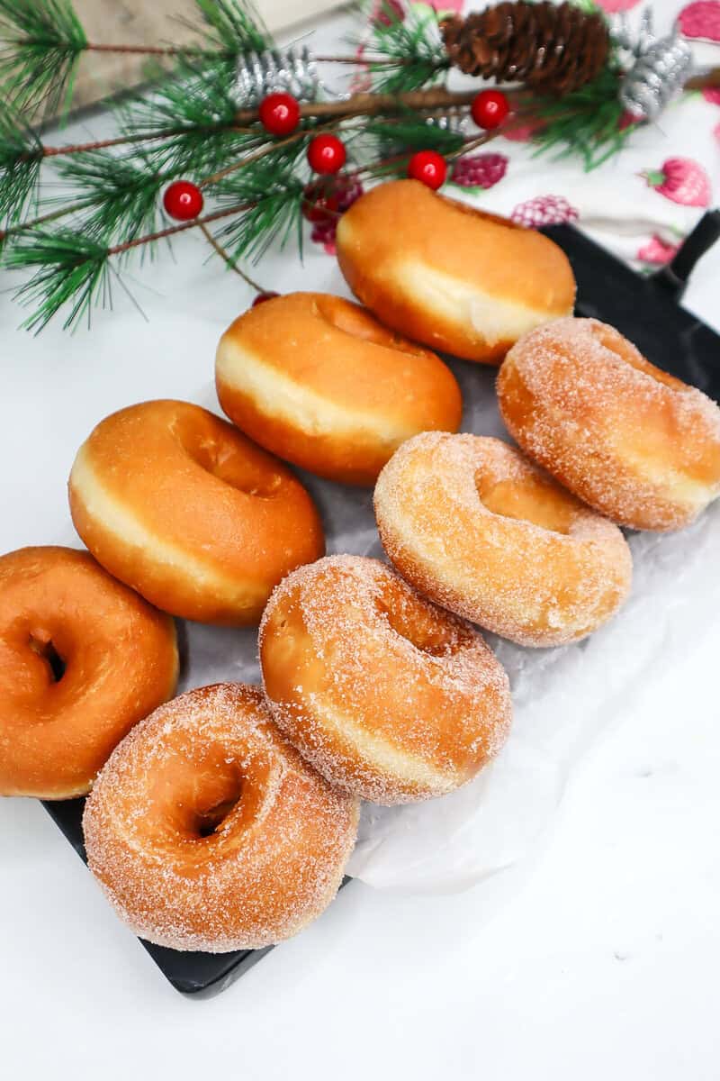 Lines of Homemade Donuts, some sugared and some not.