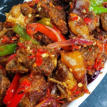 Bowl of Asun (Spicy, Smoked Goatmeat.)