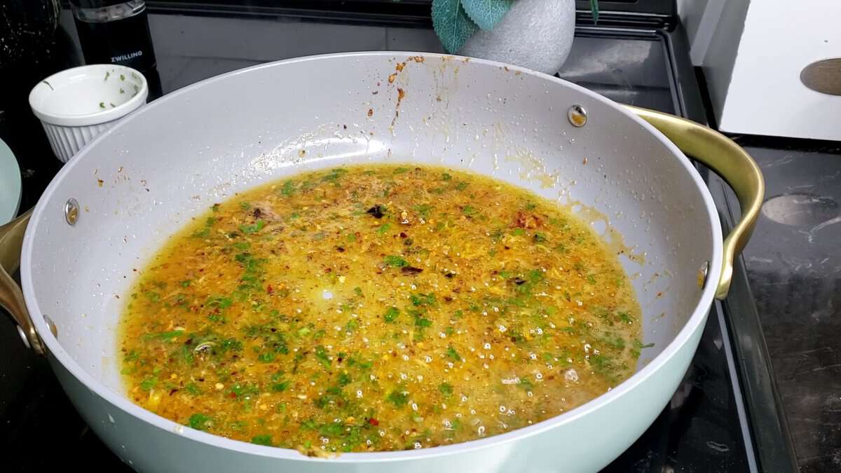 Lemon pepper sauce bubbling in a pan.