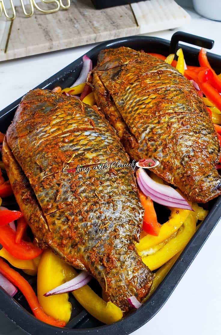 Grilled tilapia on a bed of vegetables.