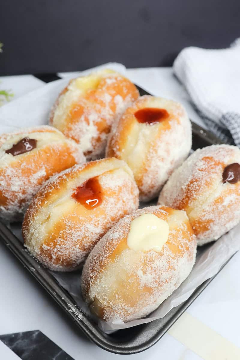 Tray of different-flavored Milk-Filled Donuts.