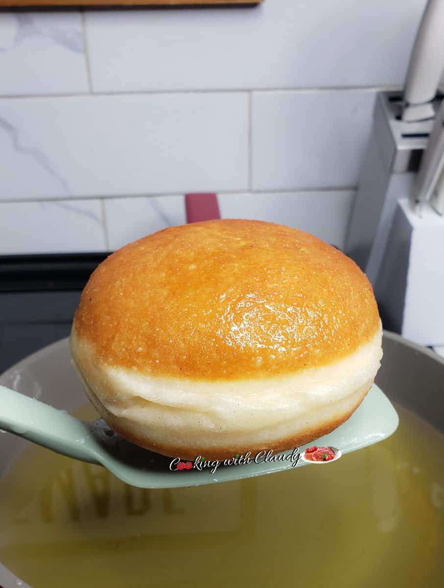 Milk-filled Donut on a spatula.