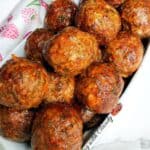 Baked meatballs in an oblong dish.