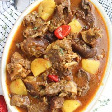 Oblong dish of Jamaican Curry Goat.