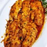 Tilapia Fillets on a white, oblong dish.