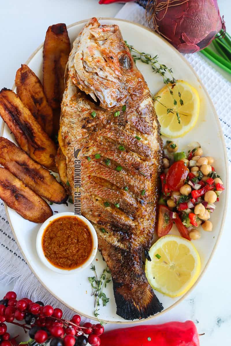 Caribbean Grilled Red Snapper on a plate with sides.