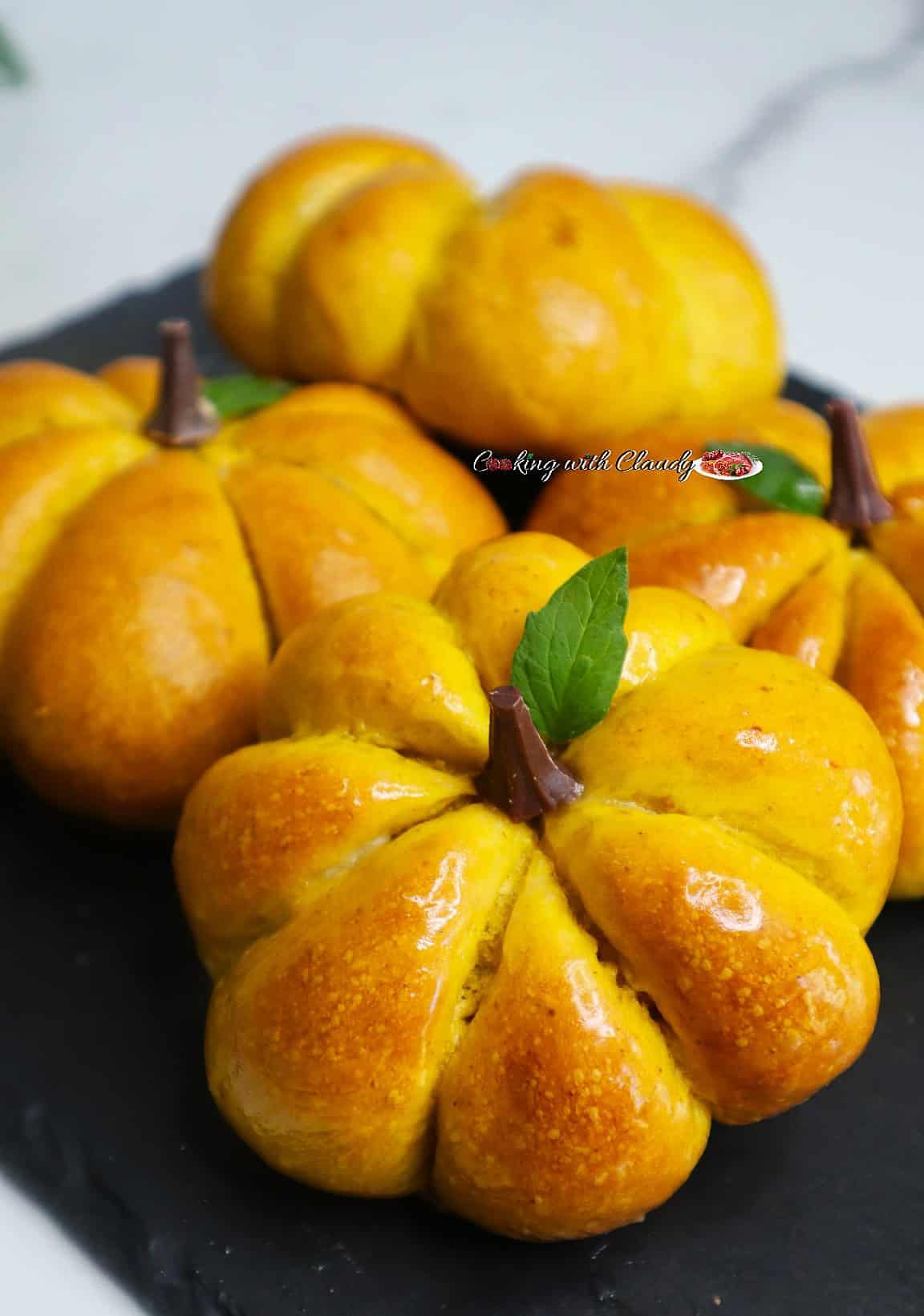 Pumpkin-Shaped Dinner Rolls in a plate.