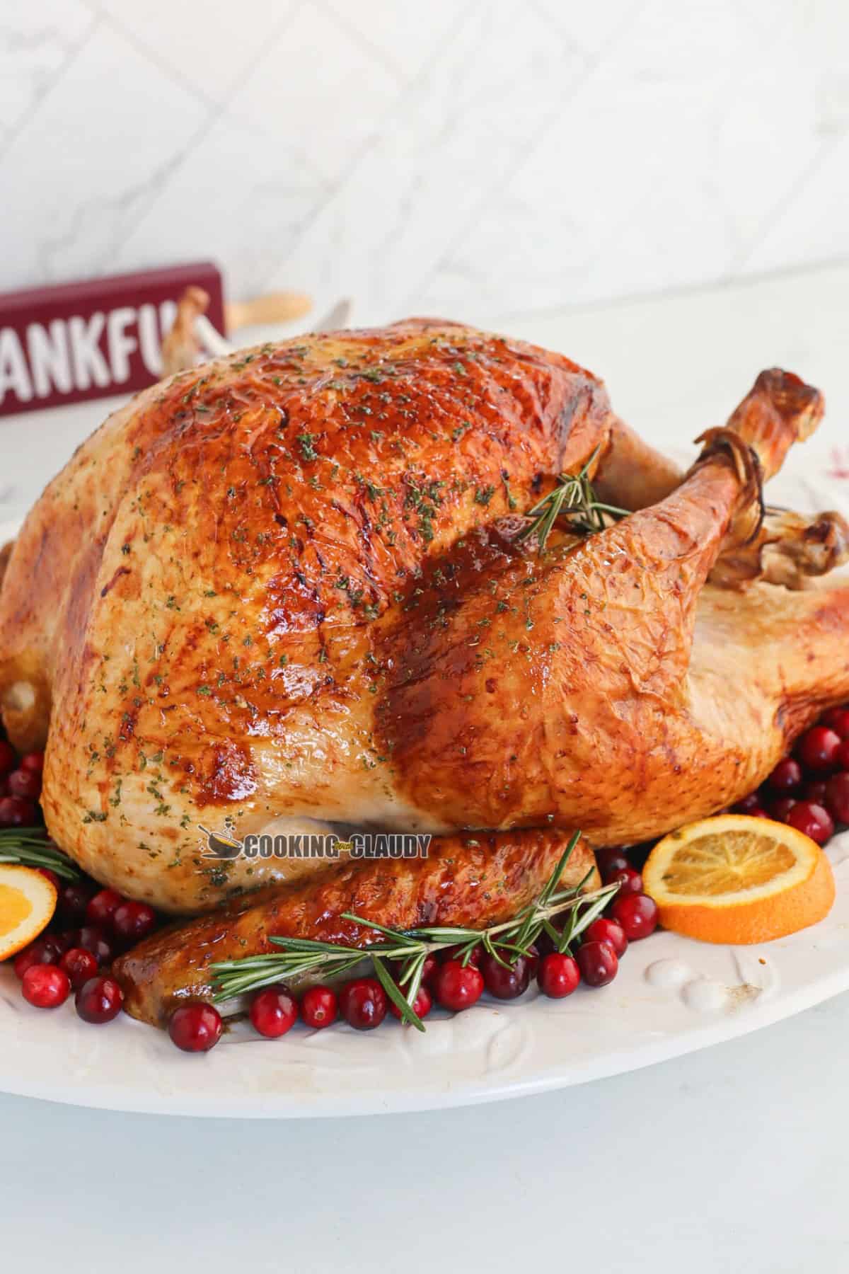 juicy, herb roasted turkey on a plate, served at Thanksgiving. 