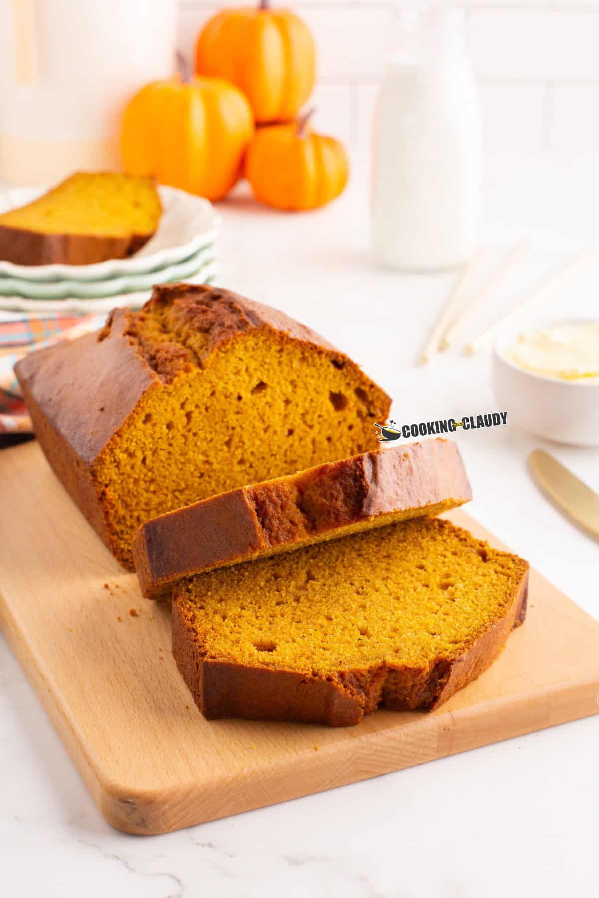 Pumpkin cake loaf slices on a wooden chopping board