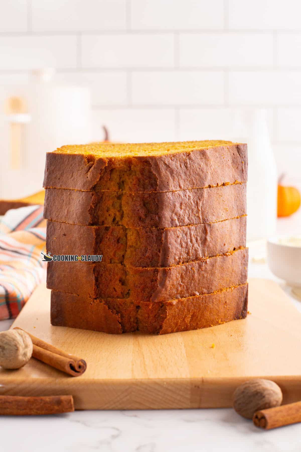 Pumpkin loaf cake slices stacked on each other.