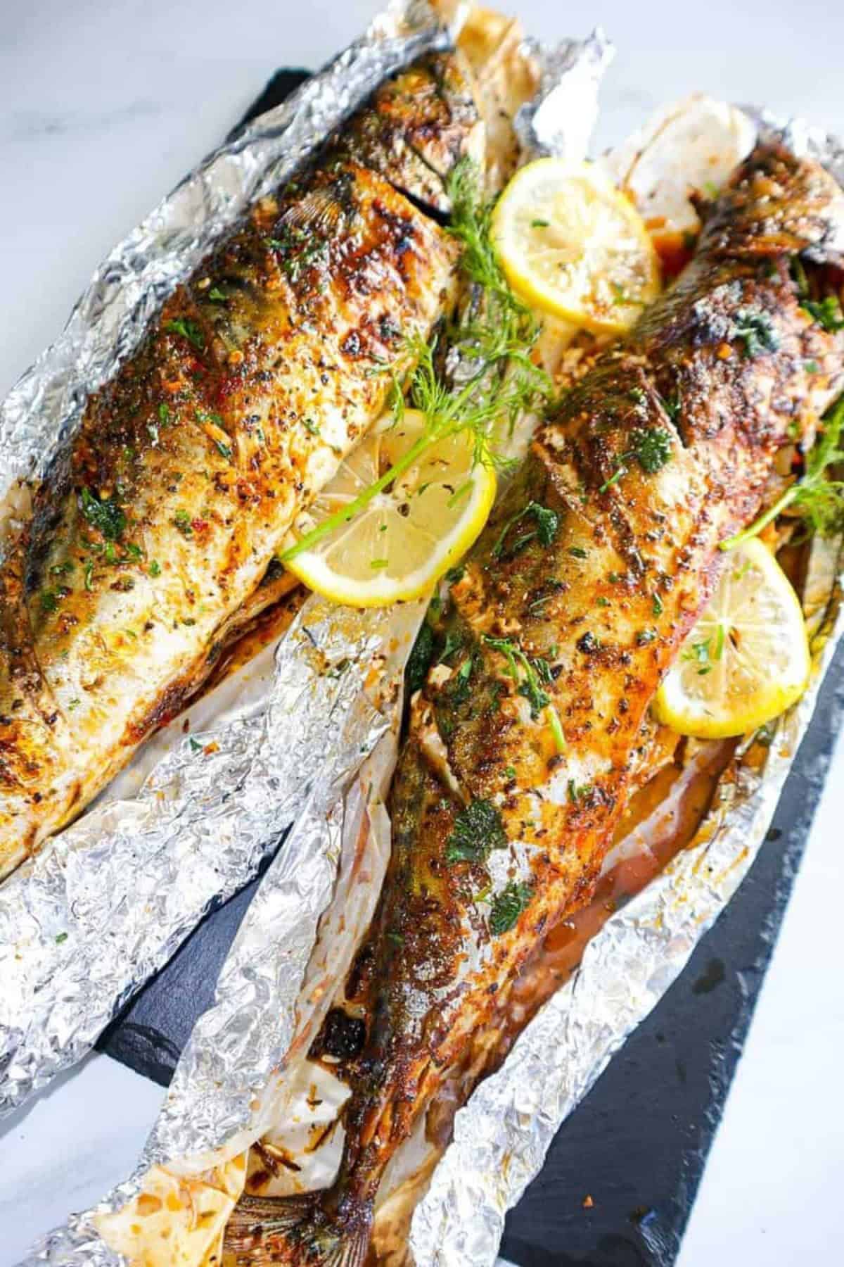 Oven-Baked Whole Mackerel on aluminum foil.