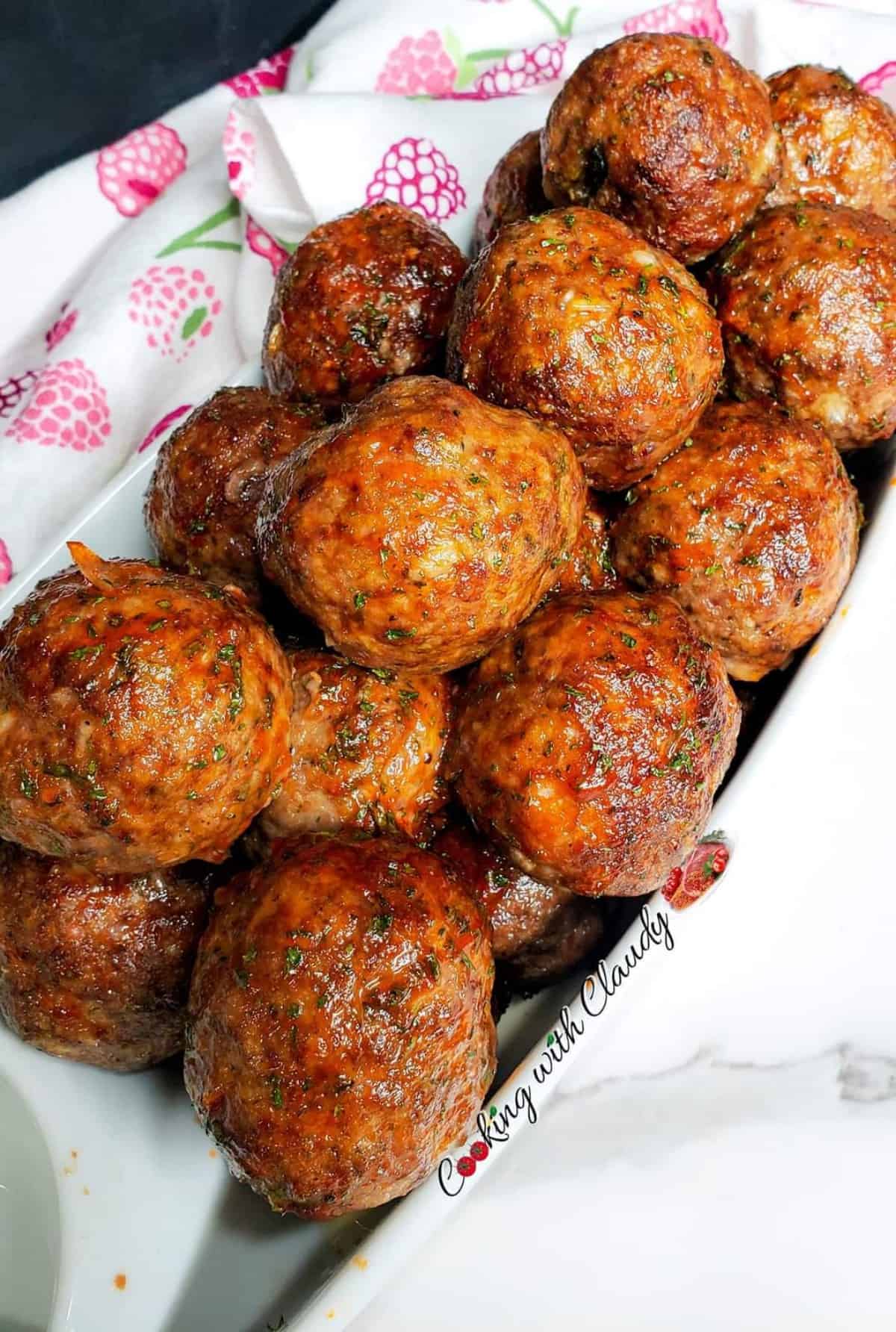 serving platter filled with juicy oven baked meatballs. 