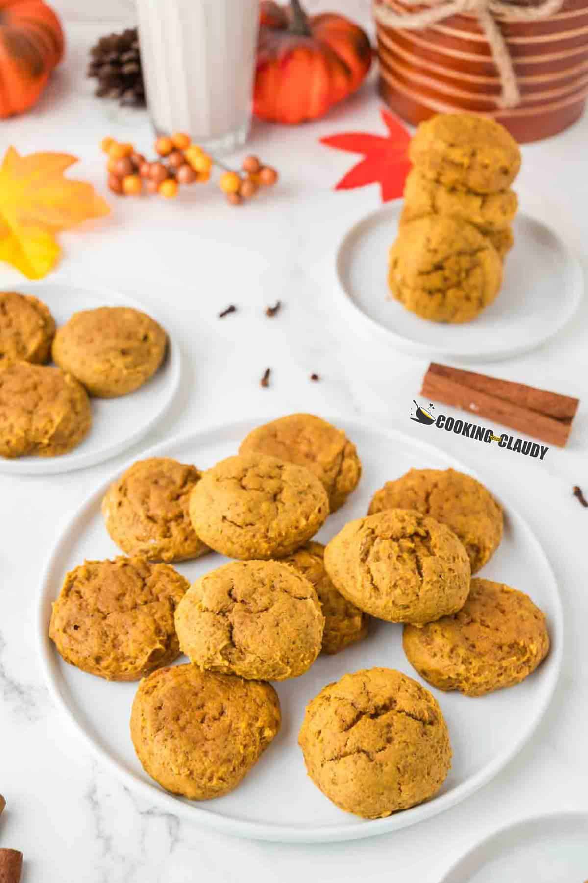 moist and chewy pumpkin spice cookies served in a plate.