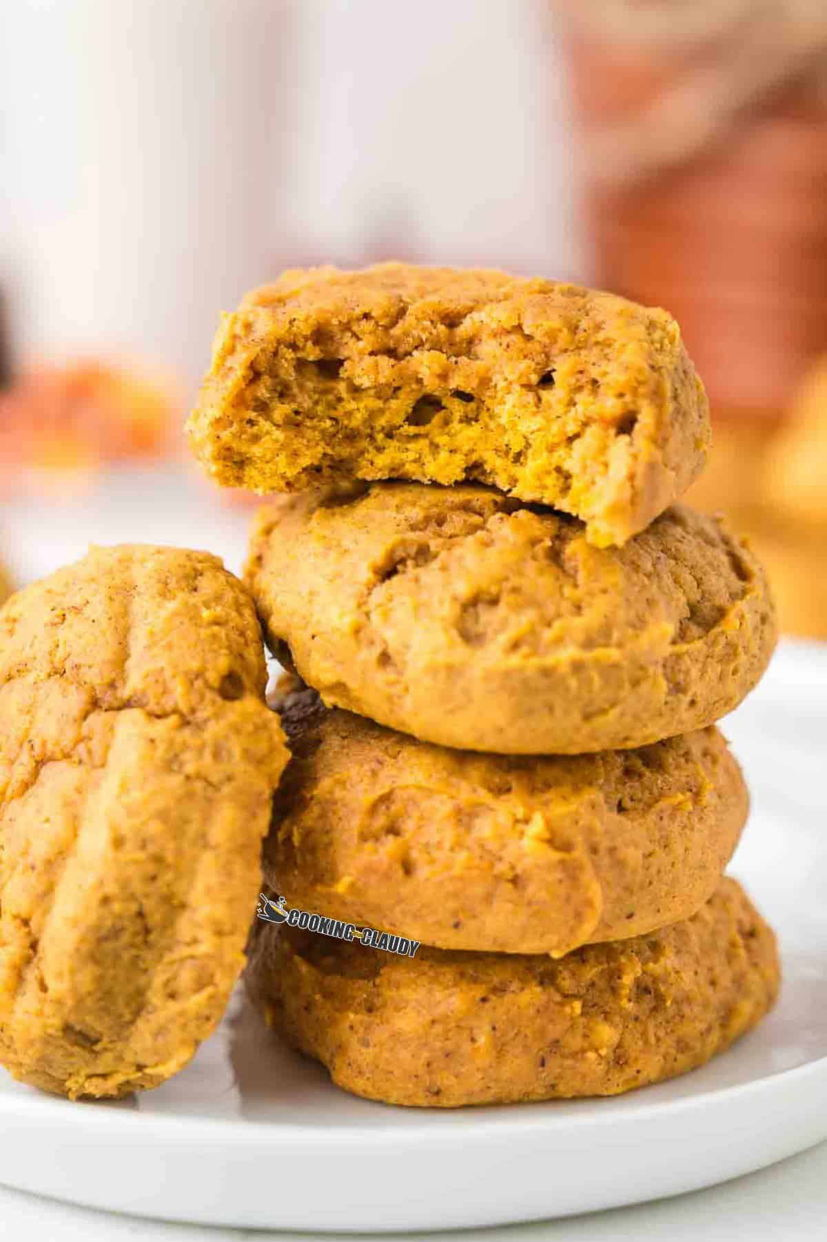 moist and chewy pumpkin spice cookies served in a plate.