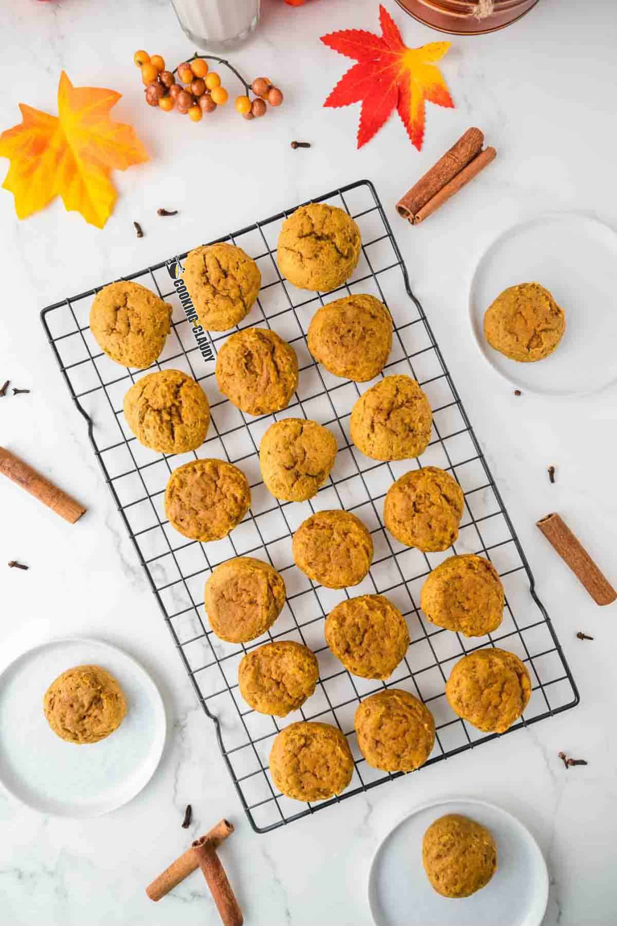 soft and fluffy pumpkin pie spice cookies on a wire rack. 