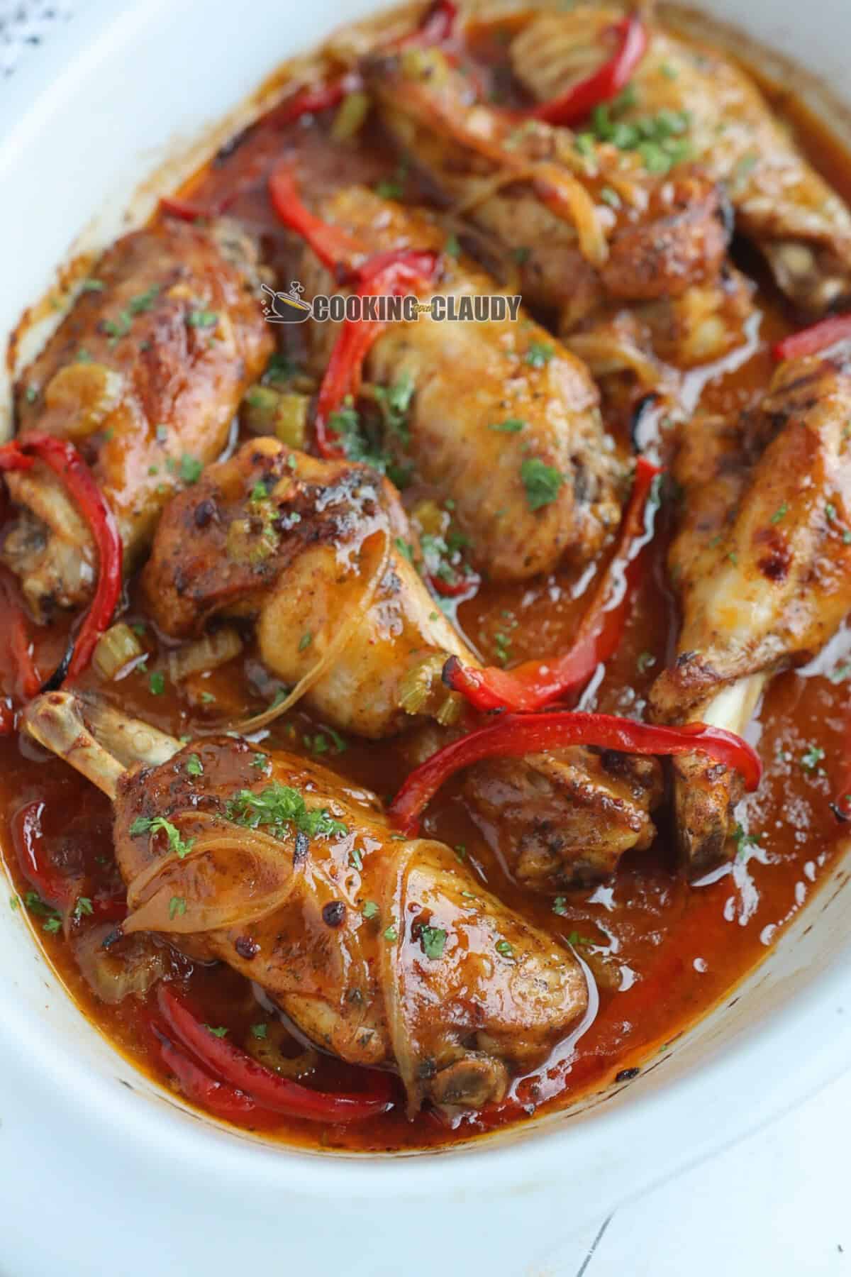 juicy turkey wings with onions and peppers covered in a spicy sauce. 