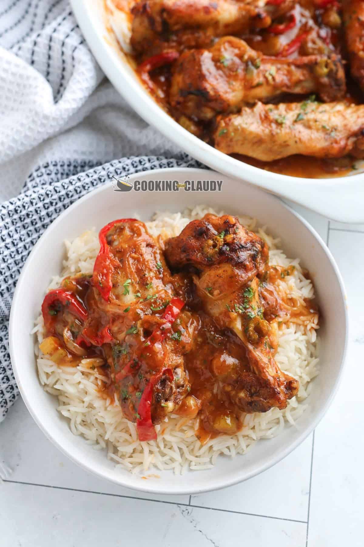 delicious smothered turkey wings served with rice in a bowl. 