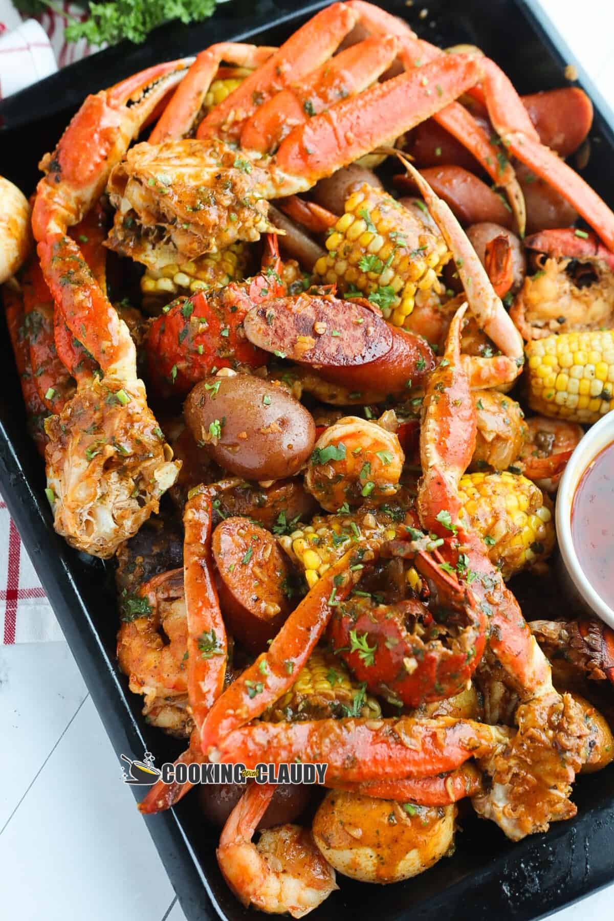 seafood boil in a bag, cooked and served in a platter. 