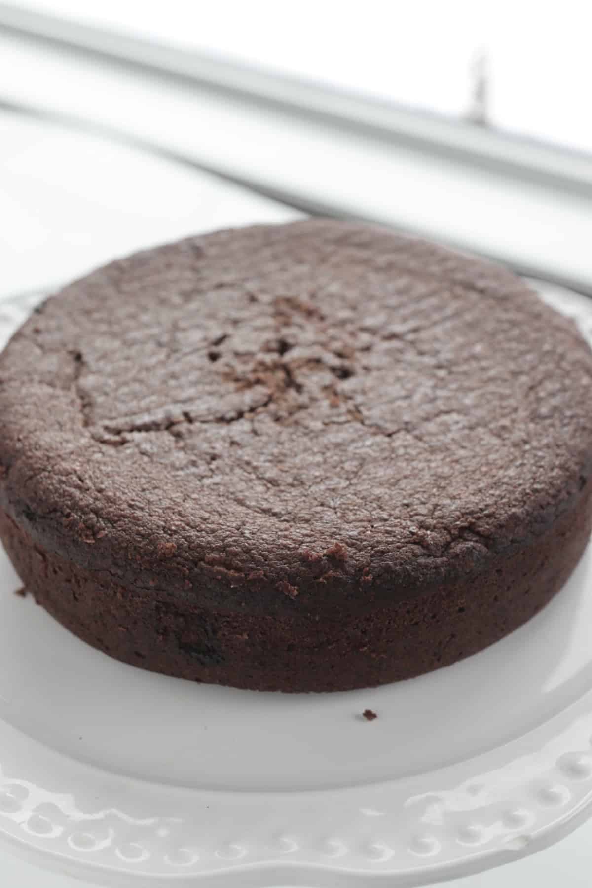 Jamaican black cake resting on a plate. 