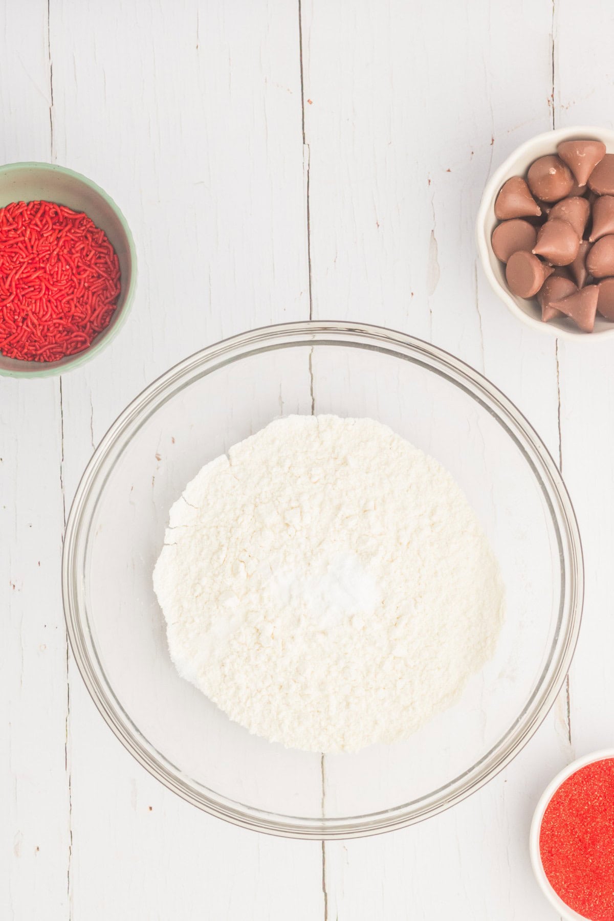 Mixing the dry ingredients for the cookie dough in a bowl. 