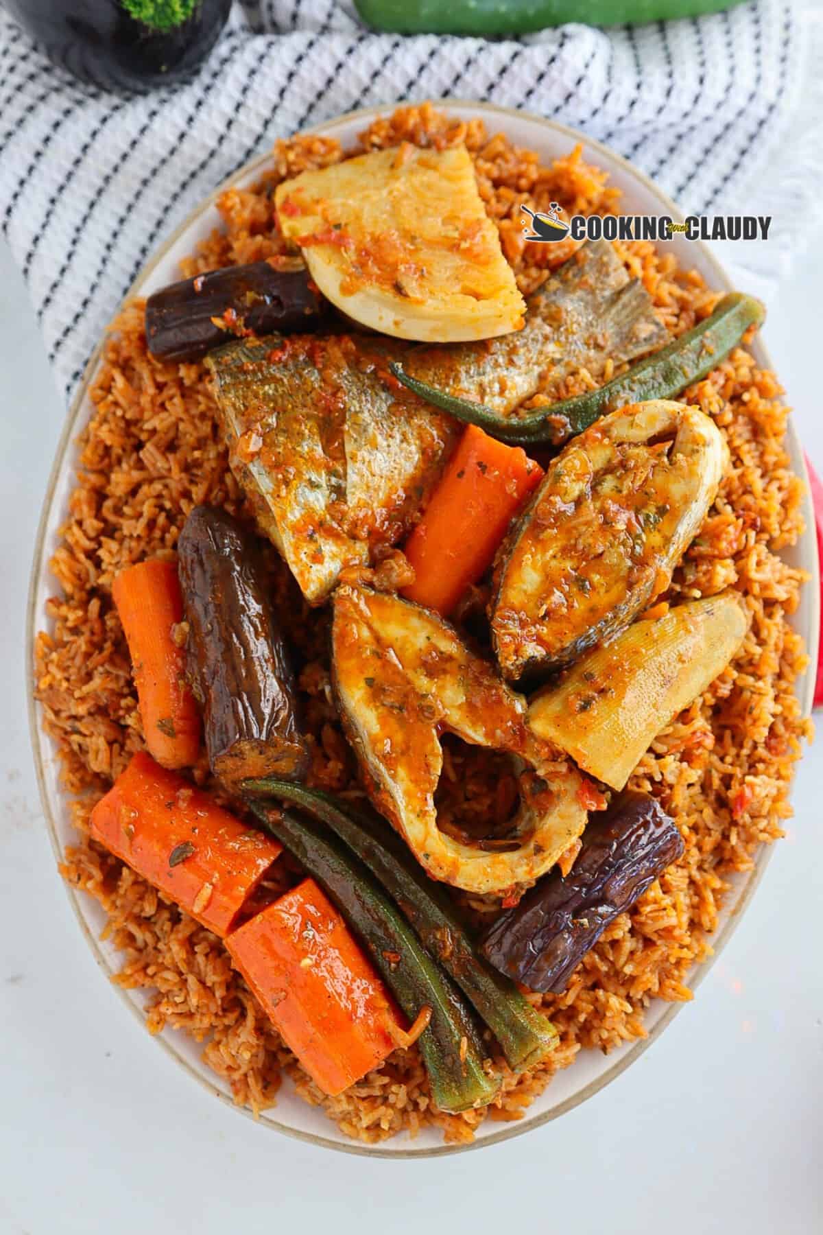 closeup of fish and veggies with flavored rice. 