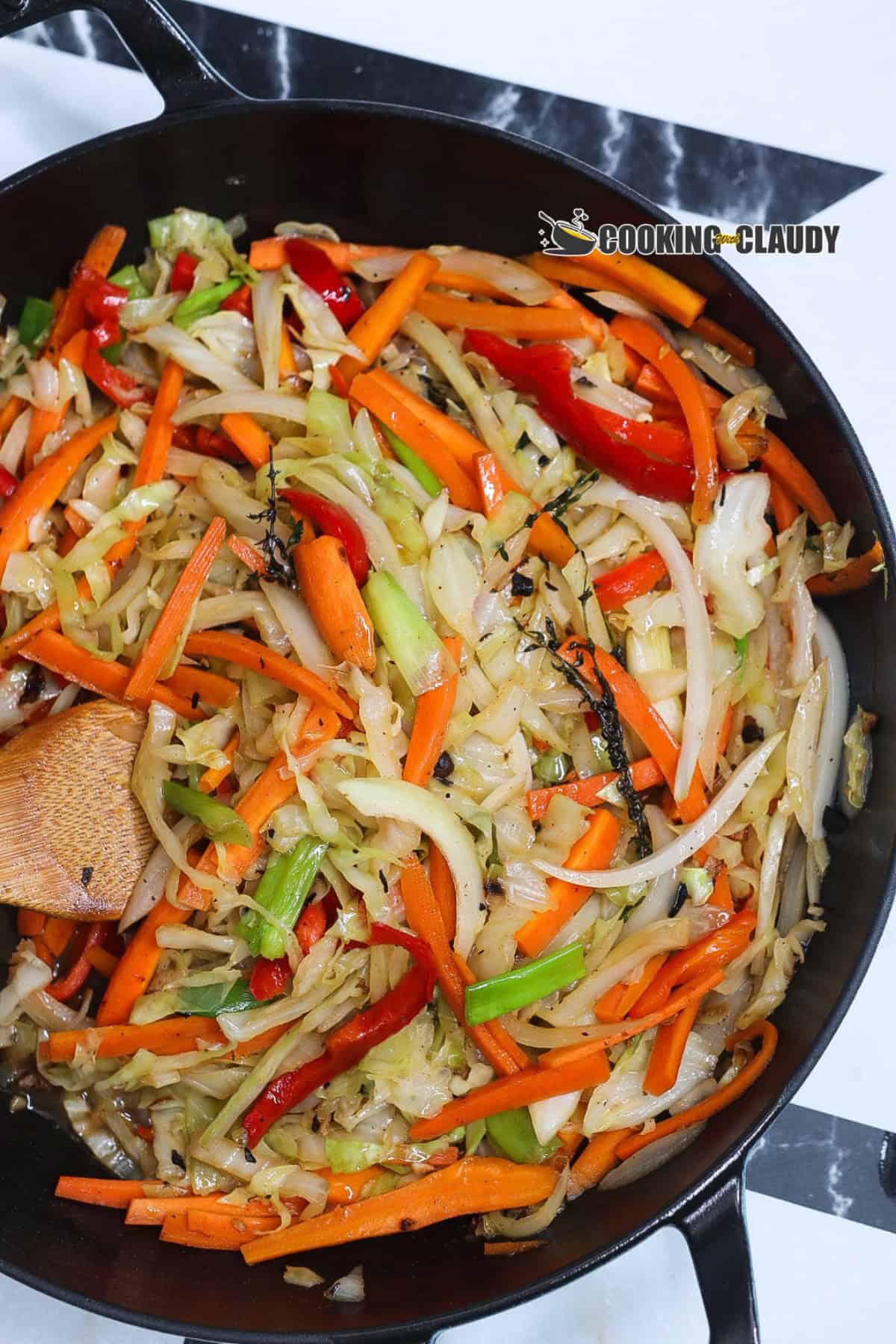 Jamaican steamed cabbage in a black skillet
