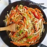 Jamaican steamed cabbage in a black skillet