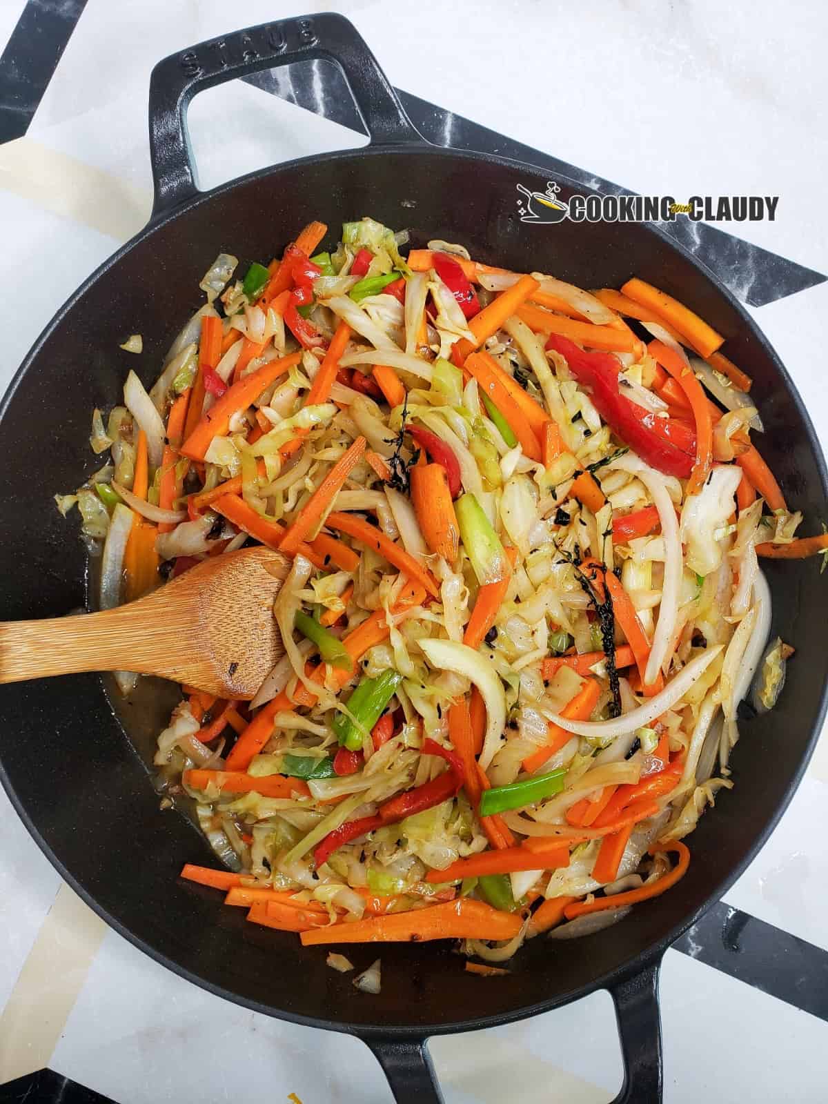 Jamaican steamed cabbage in a black skillet