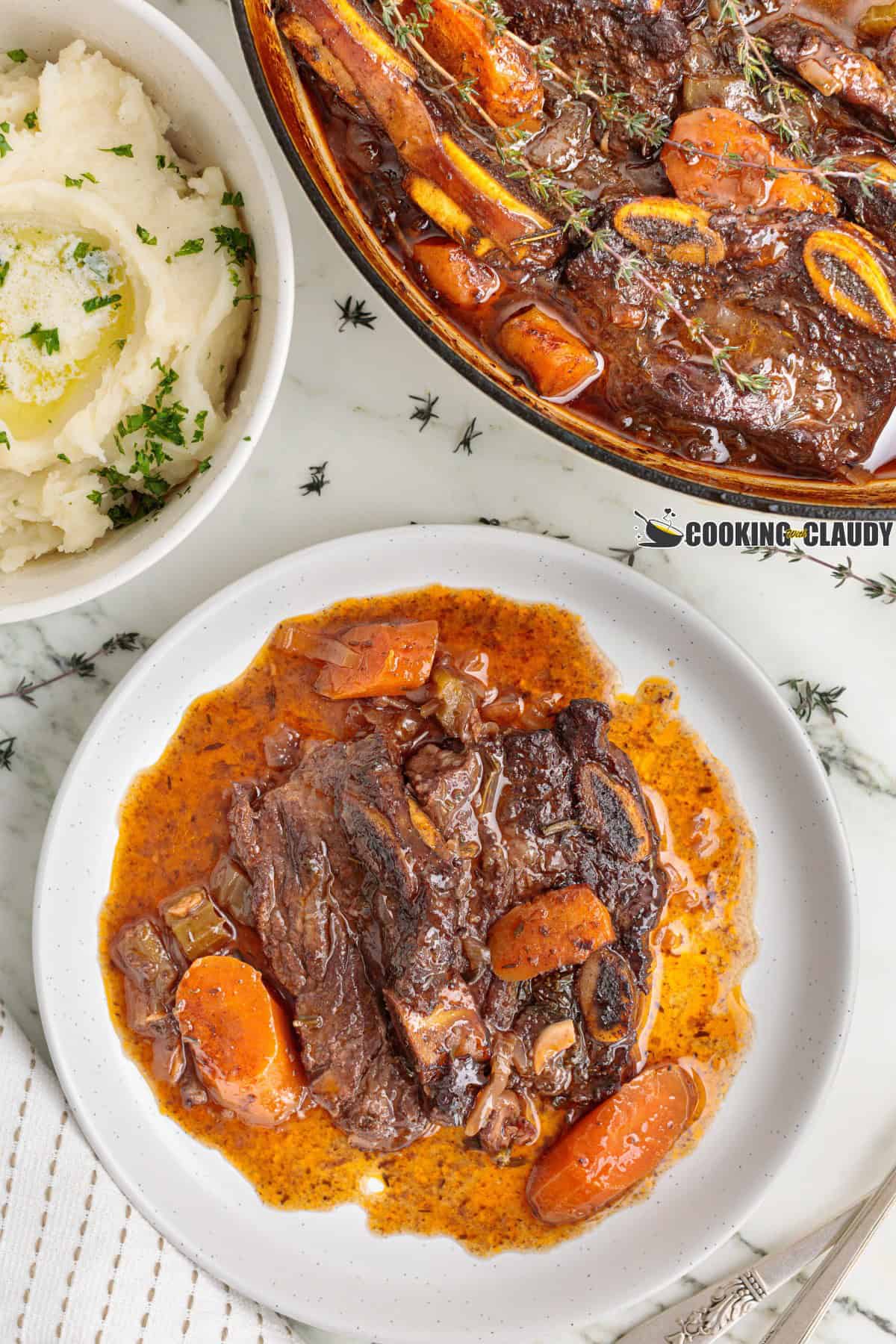 braised flanken short ribs in a Dutch oven, with mashed potatoes