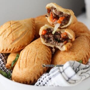 nigerian meat pie in a white bowl