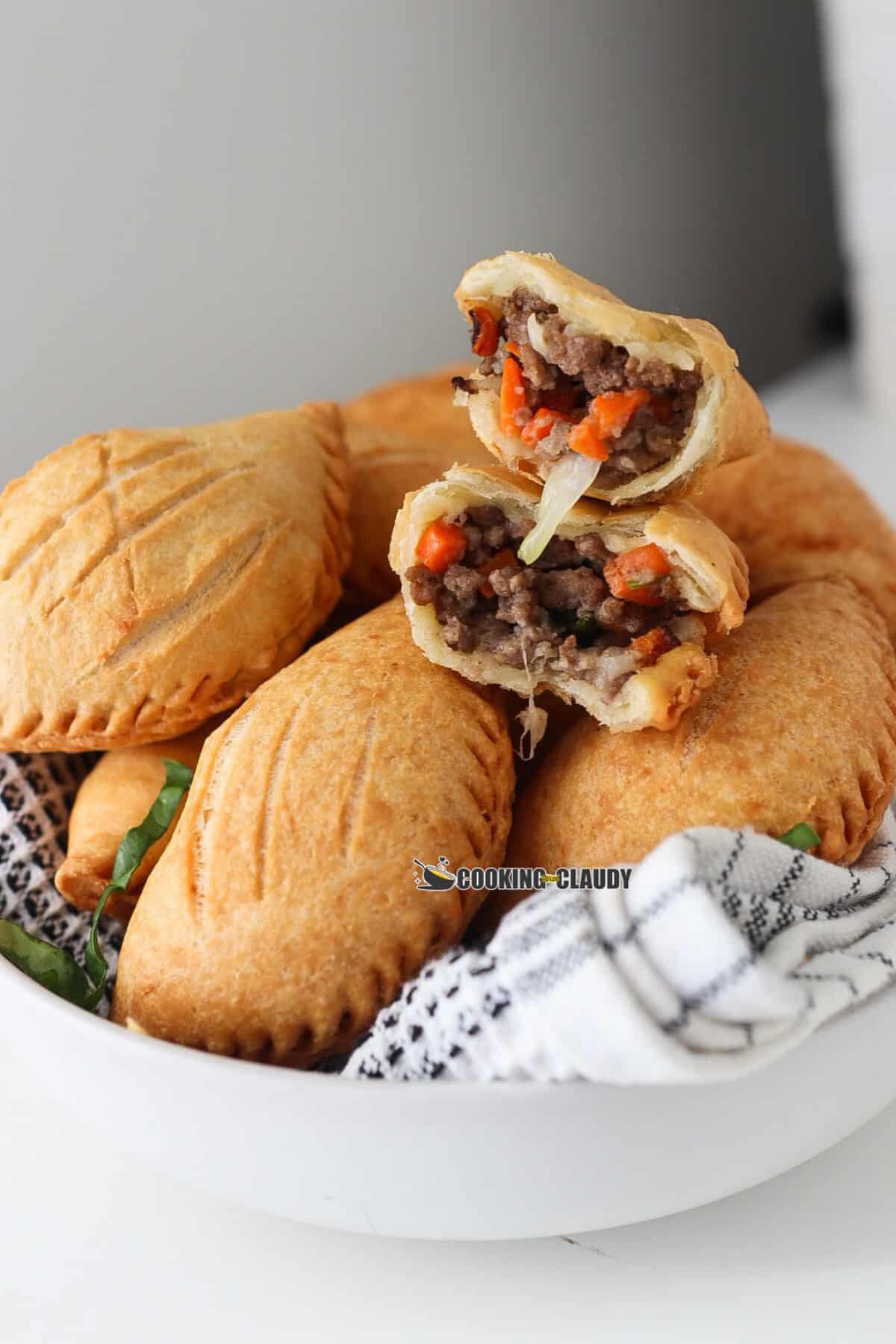 nigerian meat pie in a white bowl