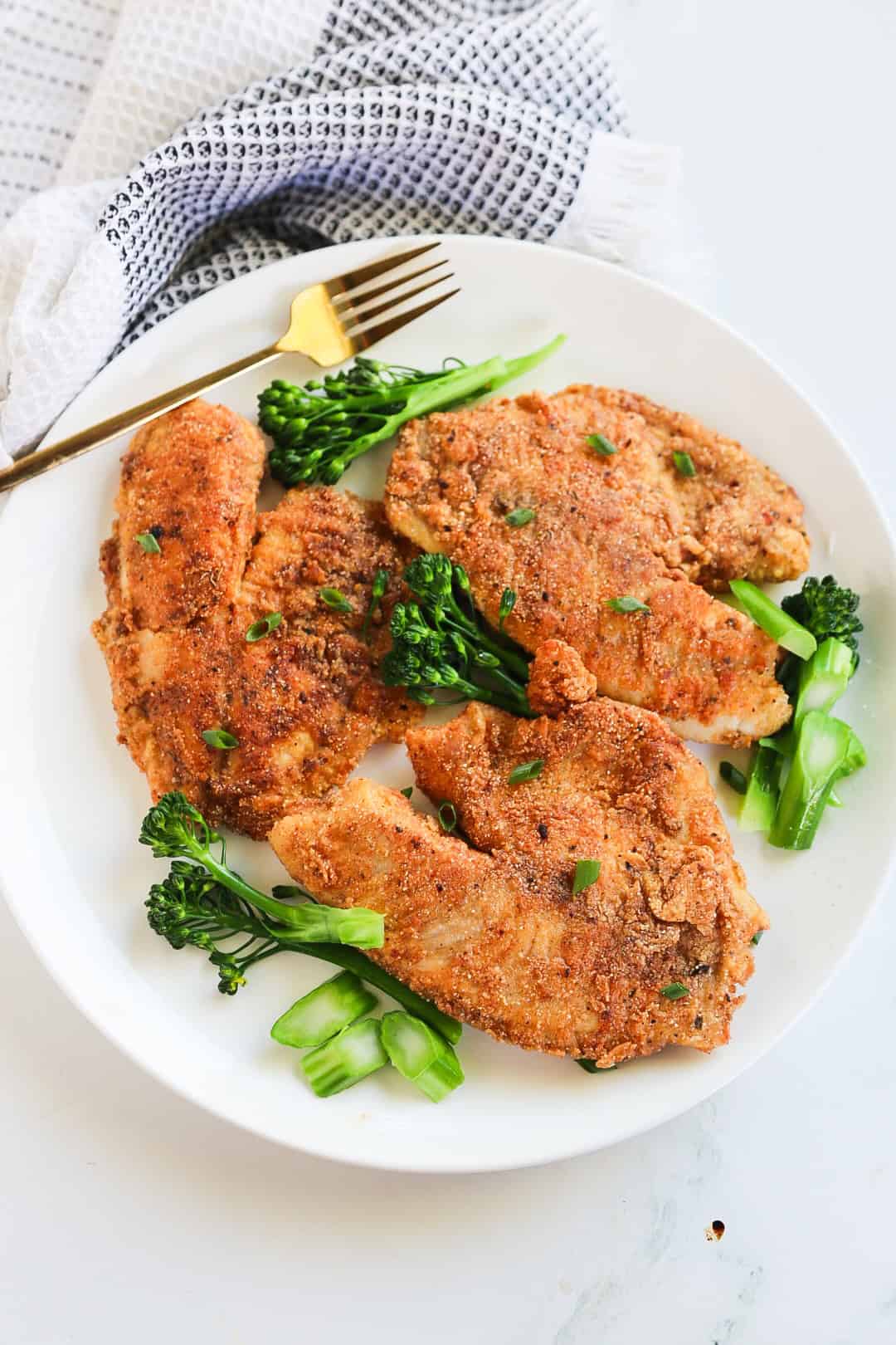 pan fried fish and broccoli in a plate