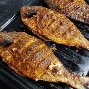 baked whole fish on a broiler pan