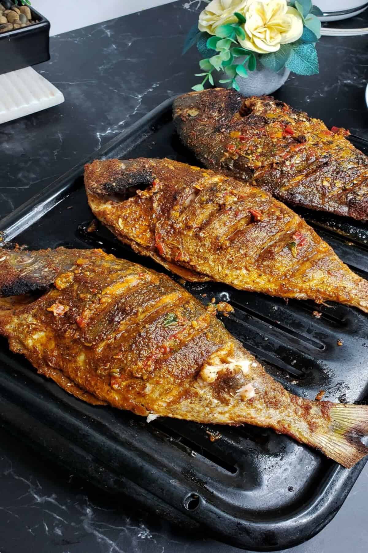 baked whole fish on a broiler pan
