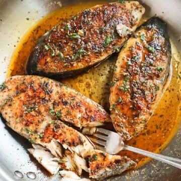 garlic butter fish in a pan