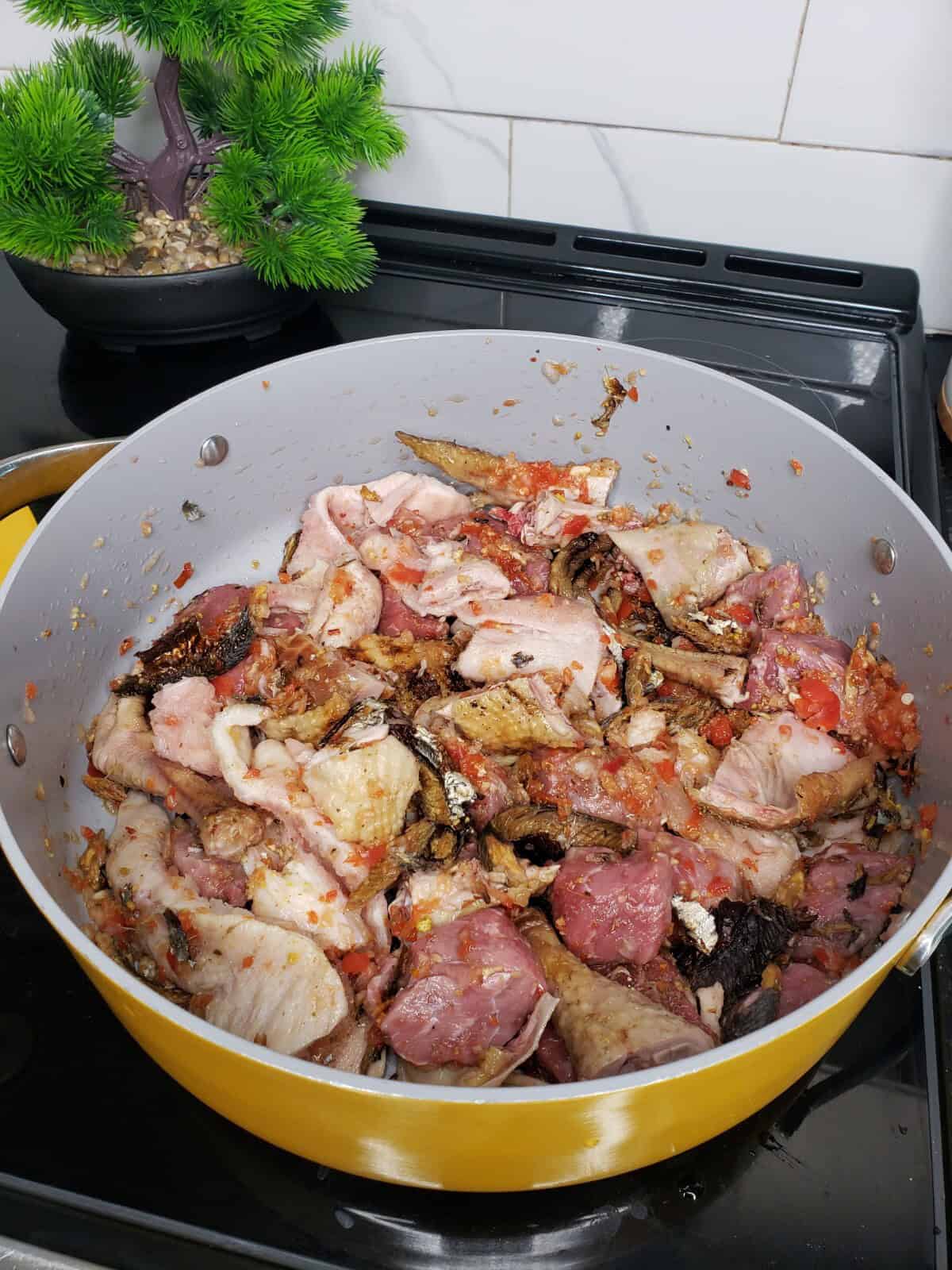 meats in a pot for sweet potato leaves stew