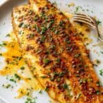 flaky baked basa fillets in a plate