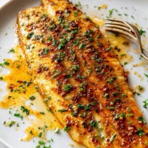 flaky baked basa fillets in a plate