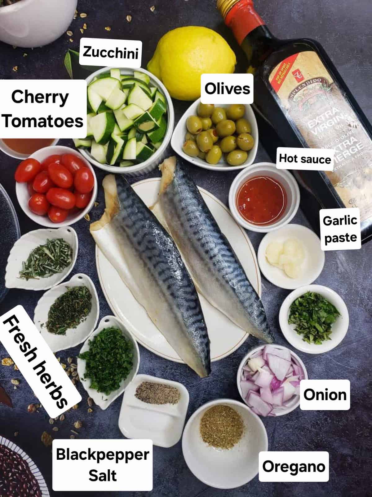 Mediterranean Baked Fish ingredients including mackerel, sweet chili sauce, and lemon.