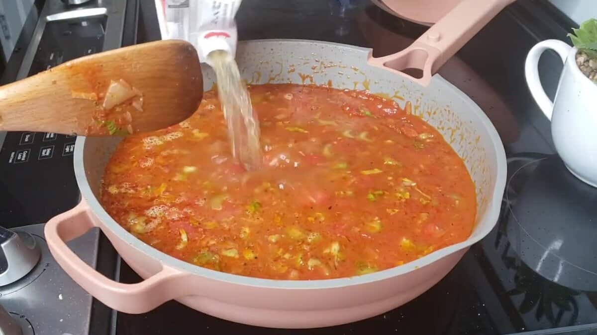 Tomato and rice mixture simmering with celery and peppers