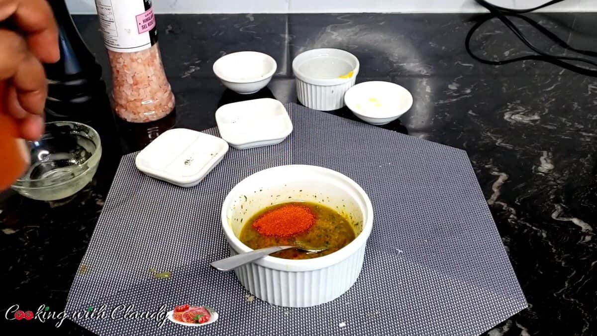 snapper fillets mixed seasoning in a bowl